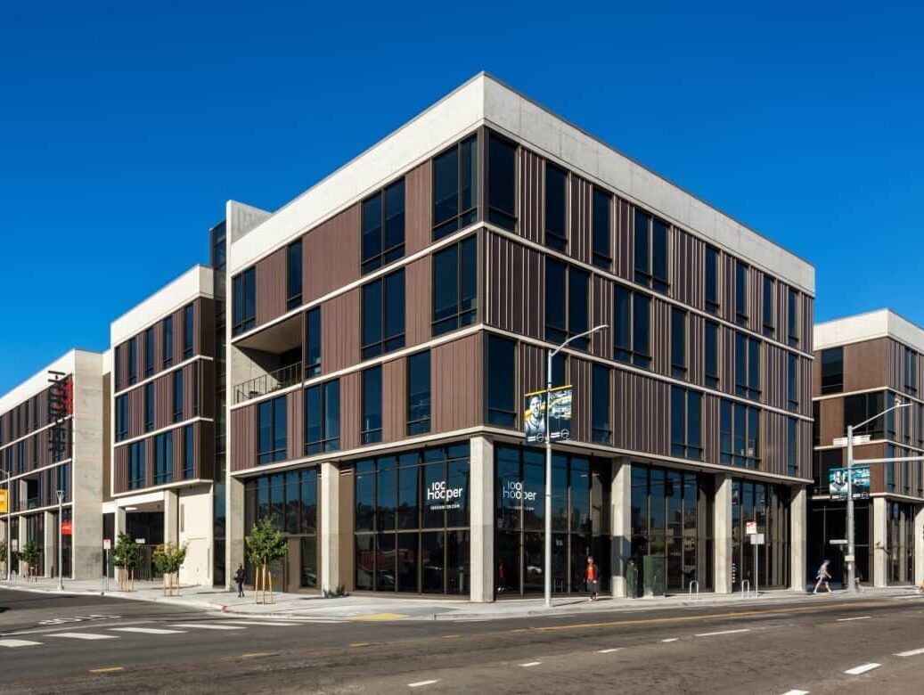 A four story building on the corner of an intersection.