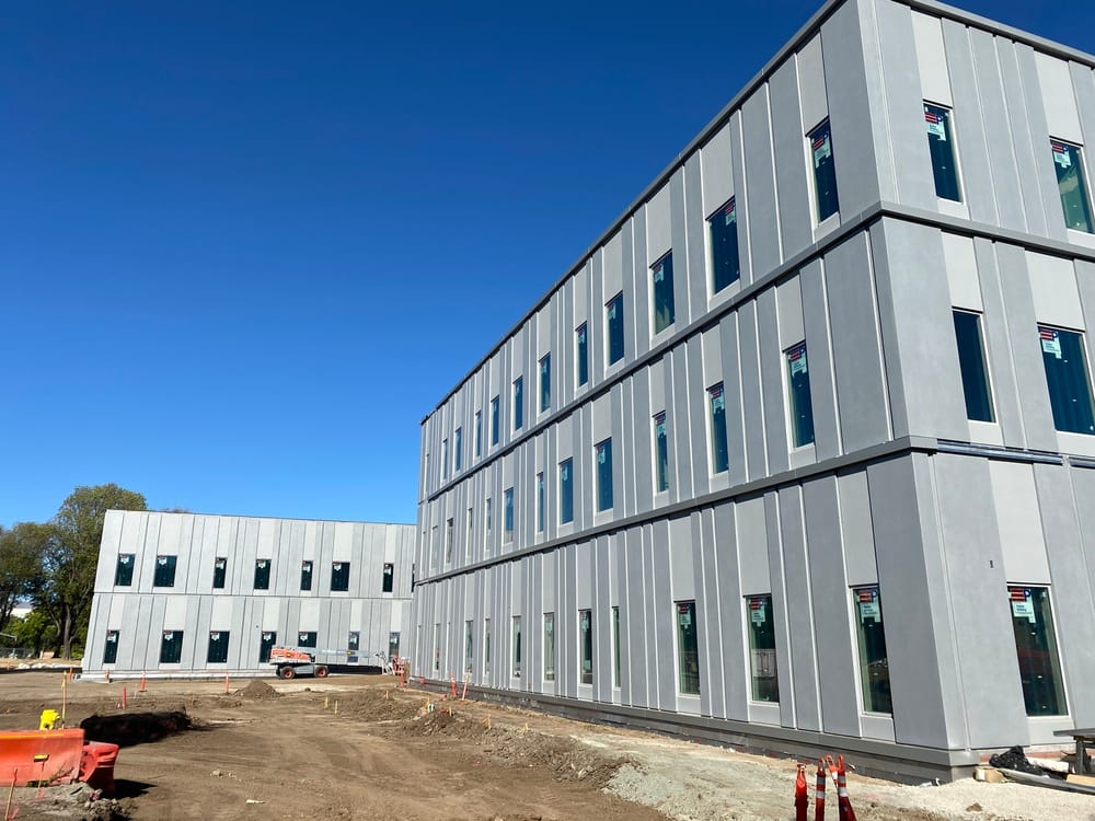 Side view of prefabricated EIFS panels with windows during installation