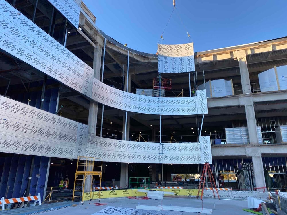 DBC prefabricated exterior panel flying into place at Atrium Health's Carolinas Rehabilitation Hospital