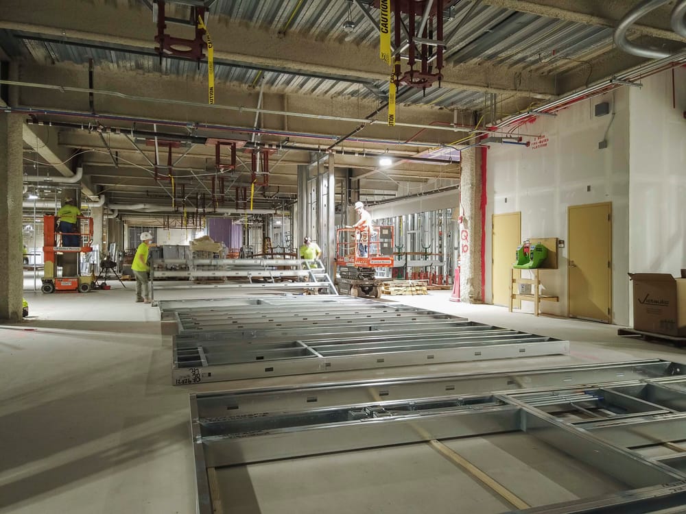 DBC prefabricated interior panels laying on jobsite being prepped for install