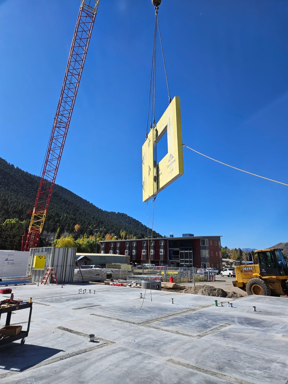 DBC prefabricated panel hanging by crane during installation