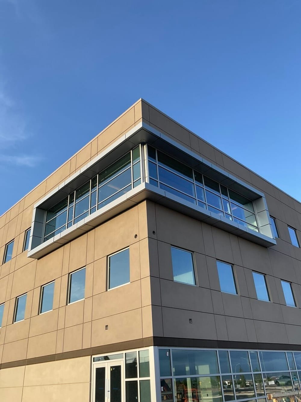 Exterior view of medical office building featuring cantilevered eyebrow framing window cutout