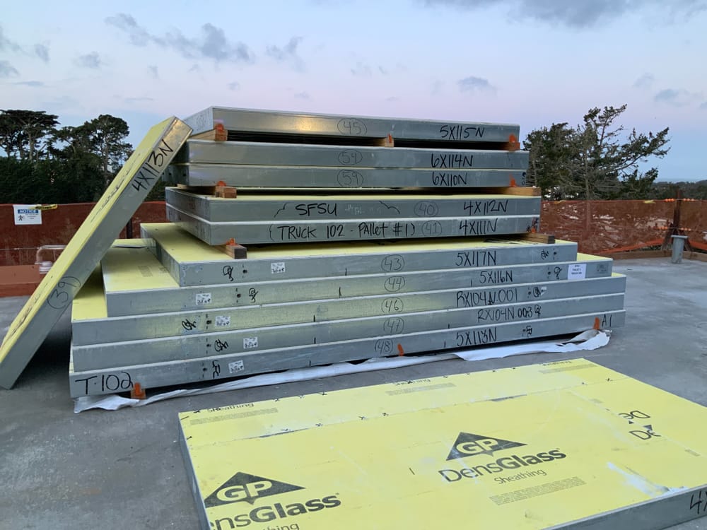 Stacked prefabricated sheathed panels on jobsite