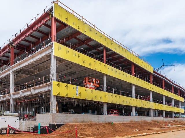 Side view of Takeda California Inc under construction and during prefabricated panel installation