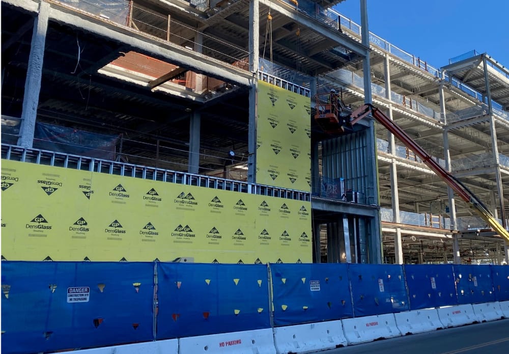 DBC prefabricated exterior panel hanging during installation