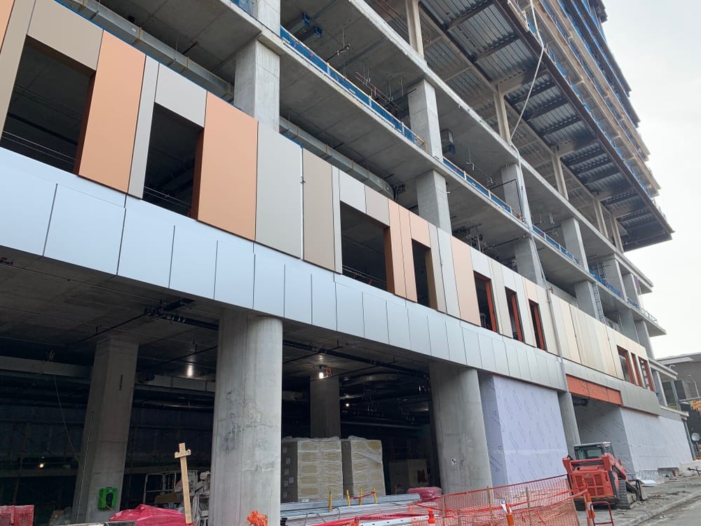 VCU exterior during construction, showing prefabricated exterior panels