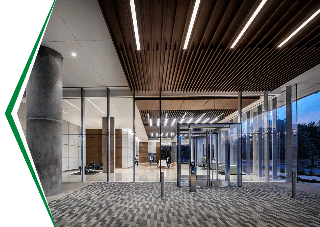 An office building lobby with floor to ceiling windows.