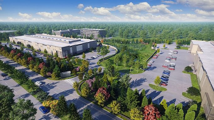 Model rendering of an ariel of 2 buildings with a parking lot