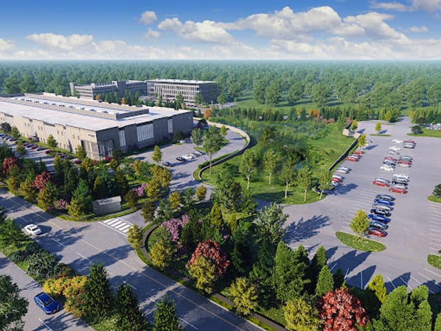 Model rendering of an ariel of 2 buildings with a parking lot