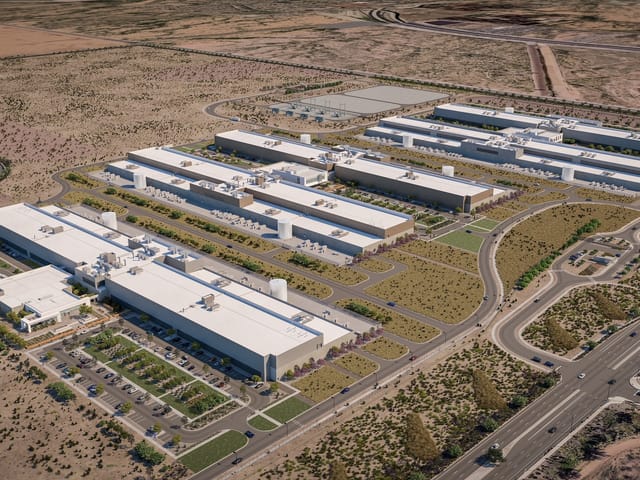 An ariel rendering view of 5 buildings in the middle of the desert