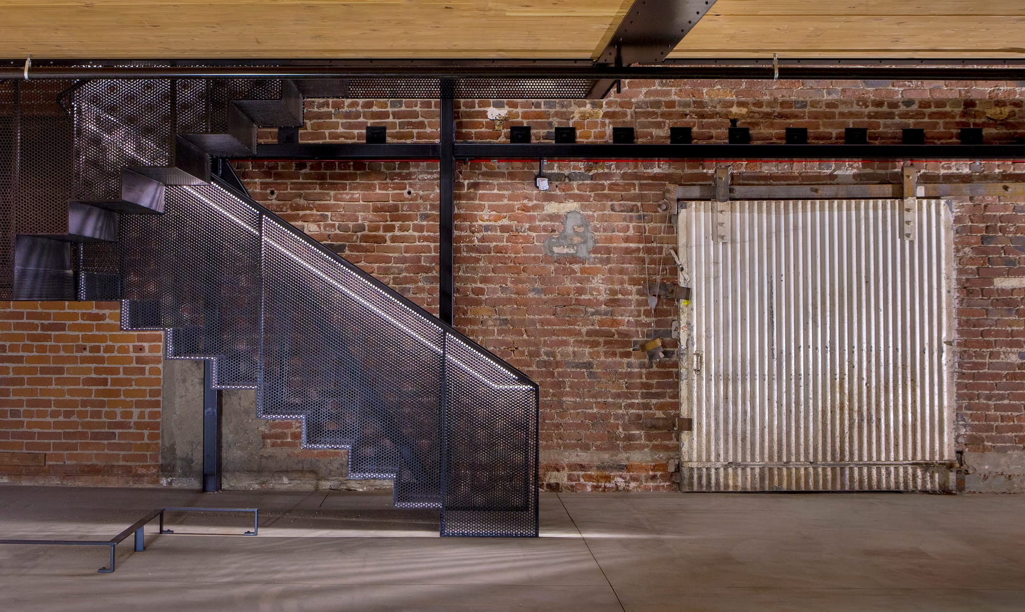 interior building with a staircase and brick wall