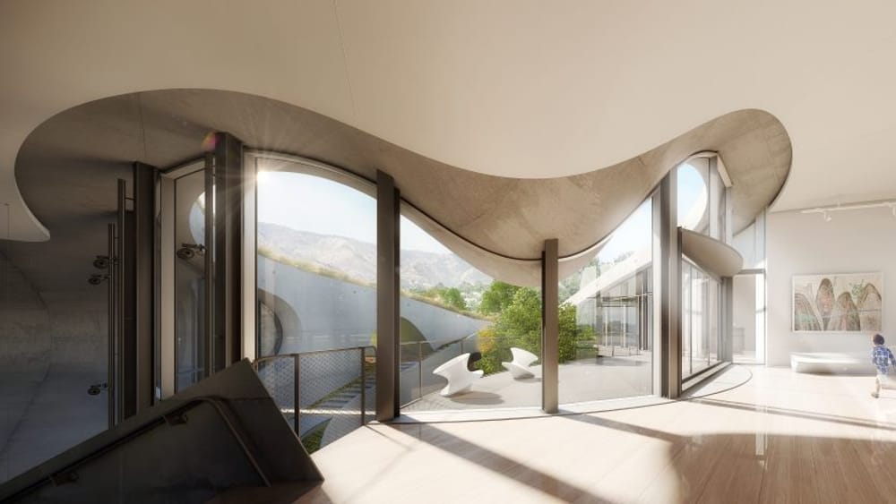 Inside view of floor to celling windows with a wave tile frame. View to the outside courtyard
