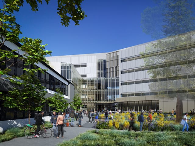 An architectural model of a 6 story building with people gathering in front of it