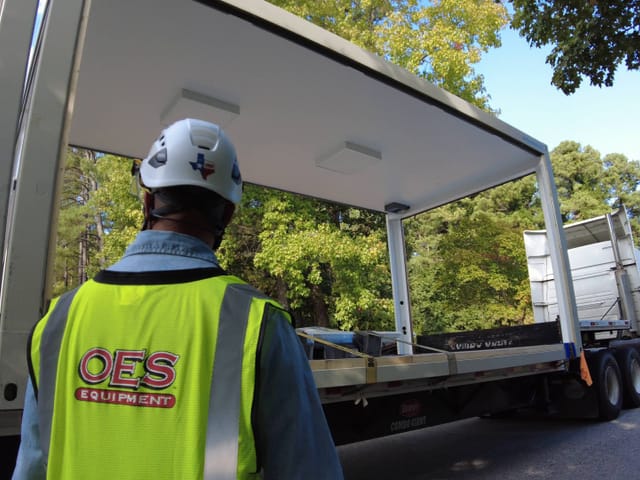 oes worker receiving a modular room delivery