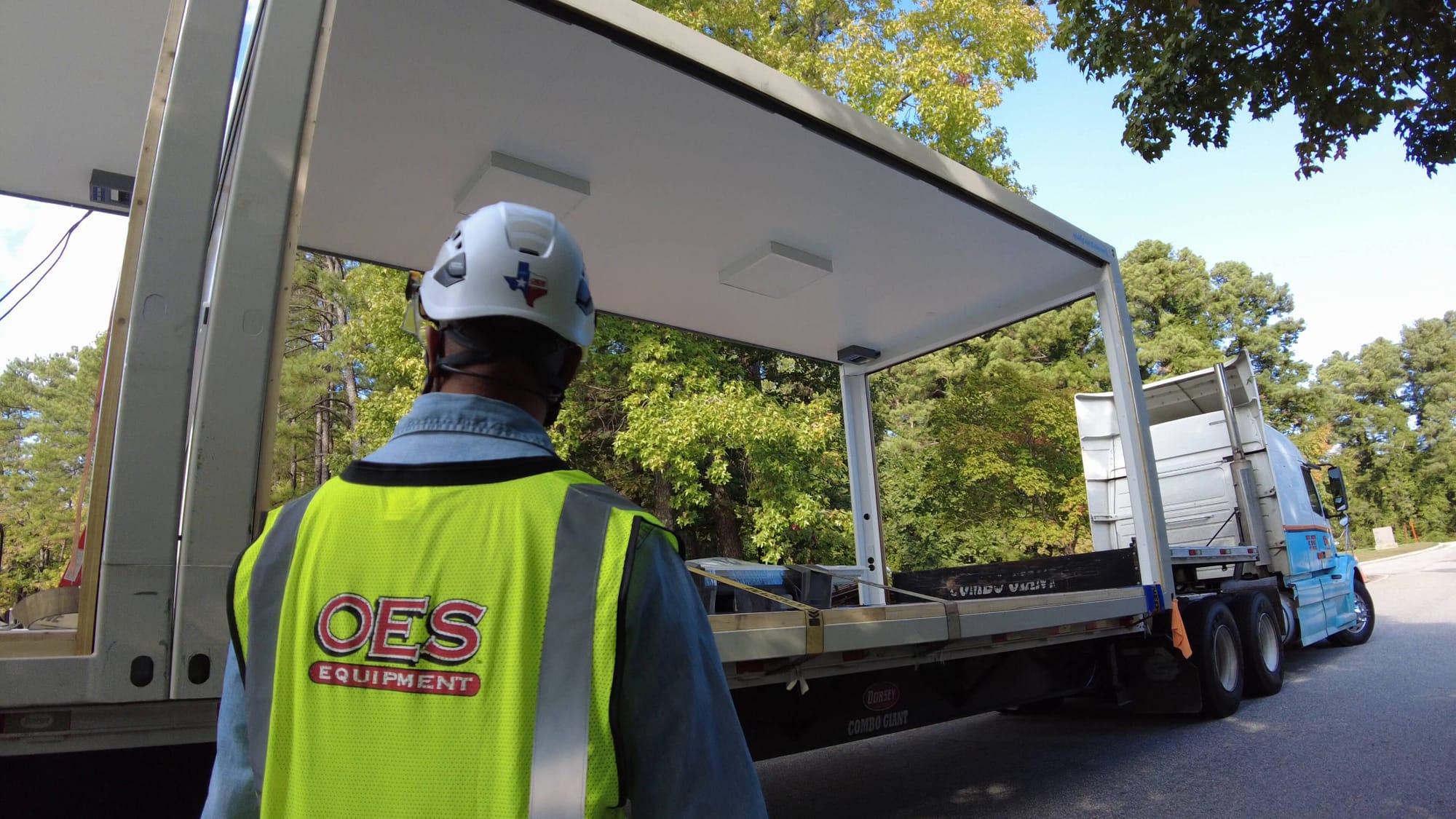 oes worker receiving a modular room delivery