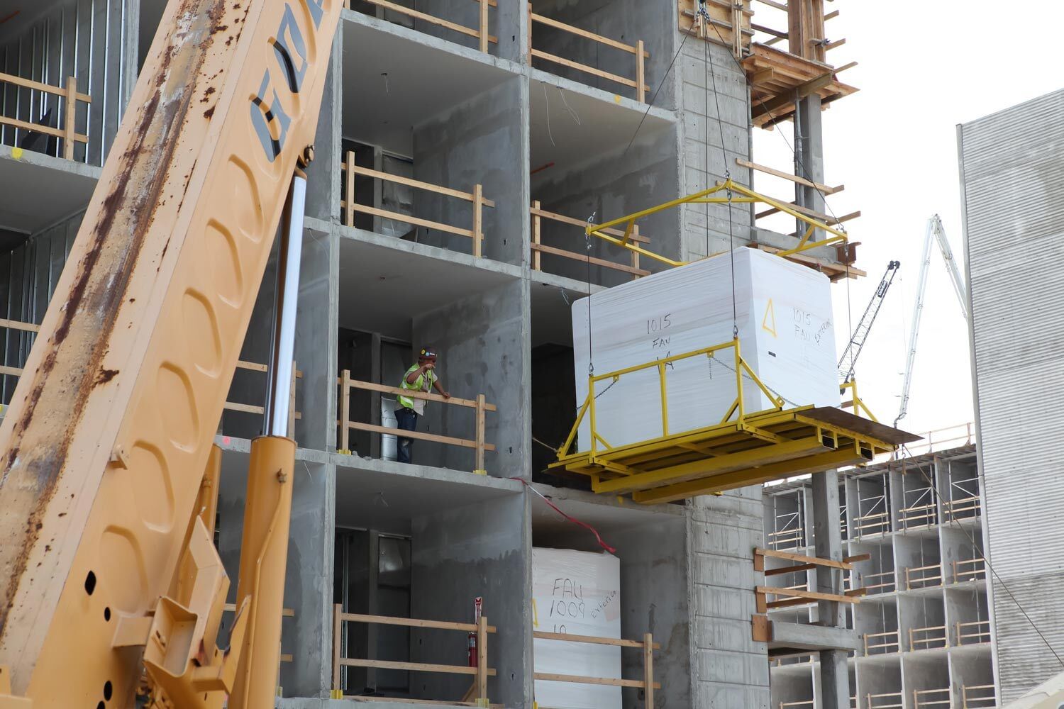 pod being lifted and set into location on jobsite