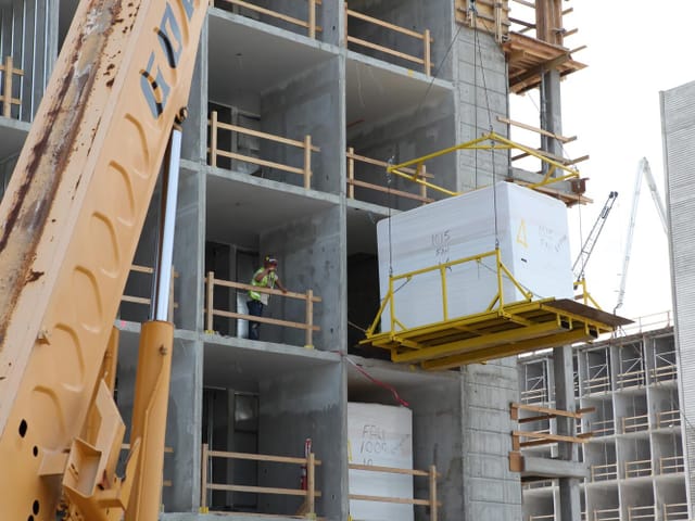 pod being lifted and set into location on jobsite
