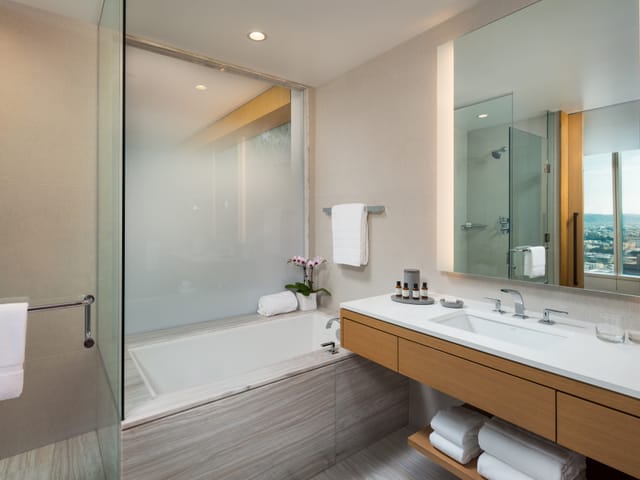 Finished bathroom, vanity, shower and bathtub