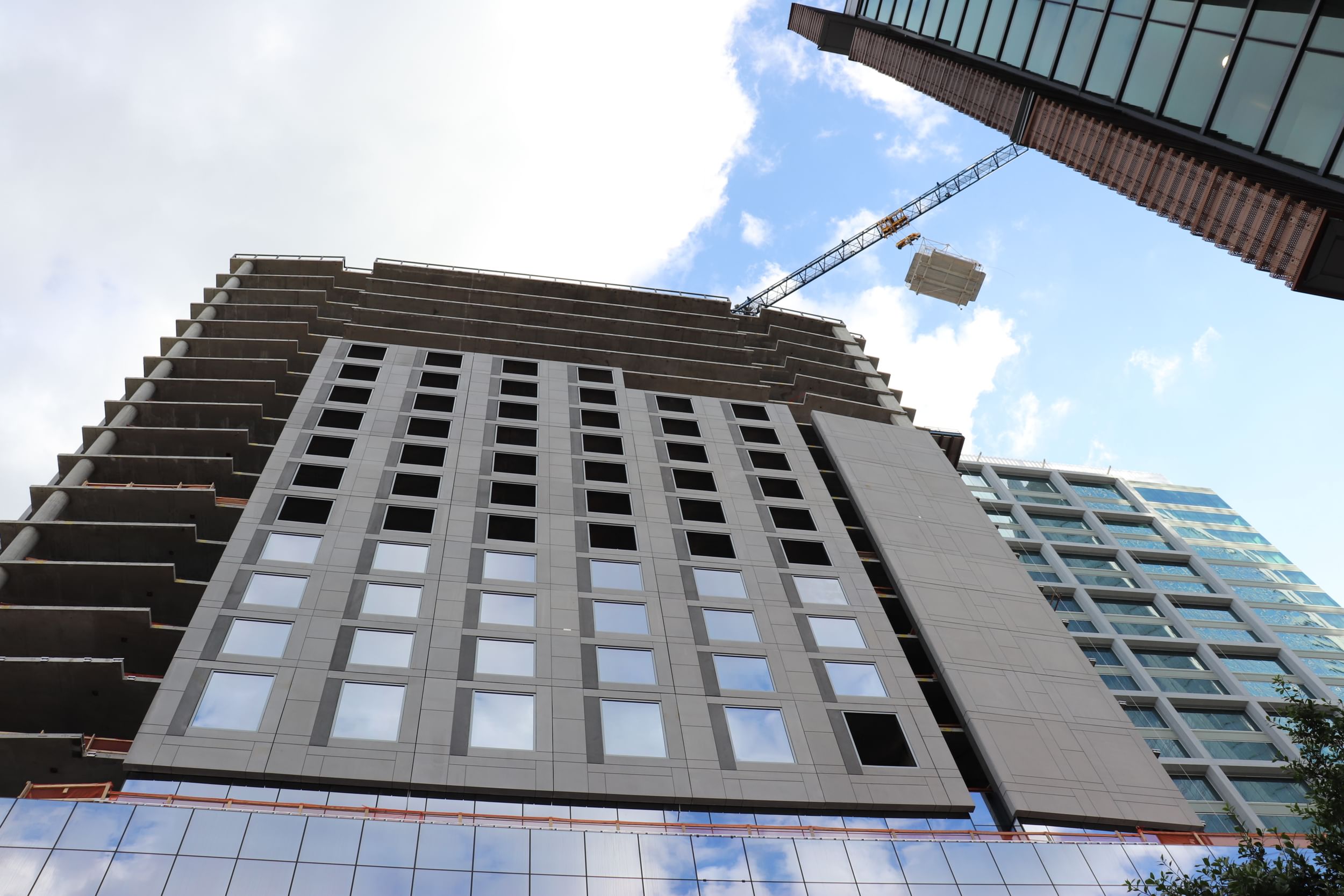 JW Charlotte Jobsite high rise building with bathroom pod flying