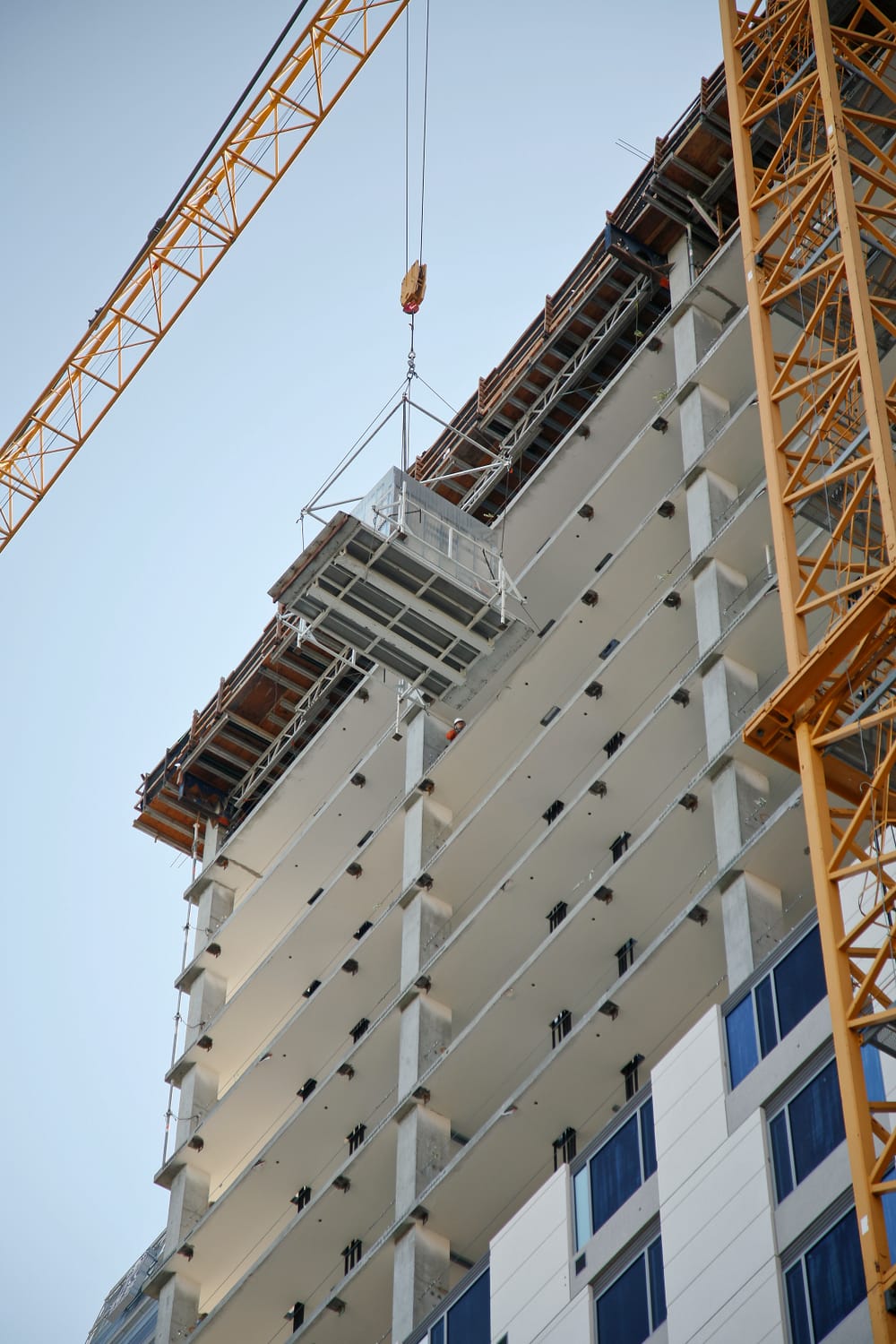 High rise hotel with bathroom pod crane flying