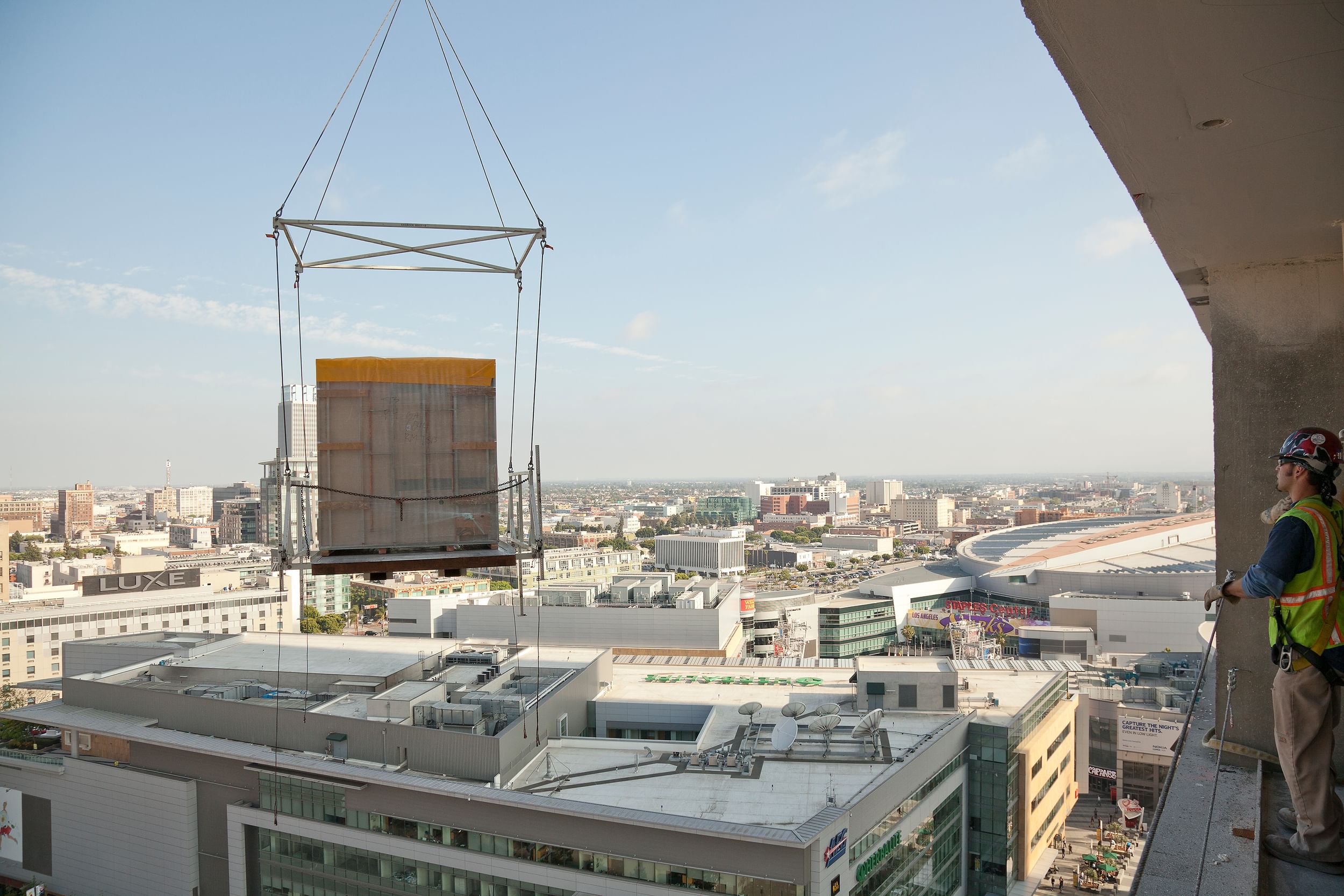Bathroom pod lifted and flying over city
