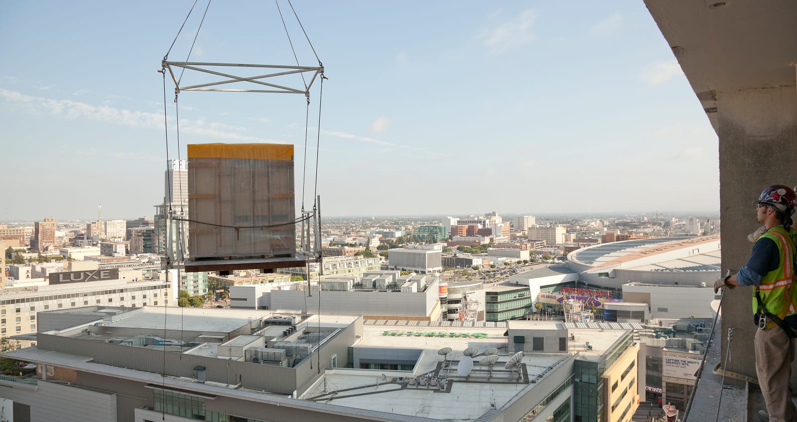Bathroom pod lifted and flying over city