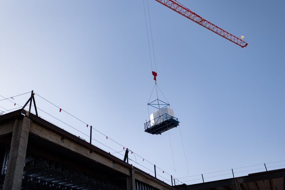 Bathroom pod in the air by crane