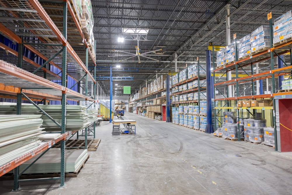 SurePods warehouse with floor to ceiling shelves.