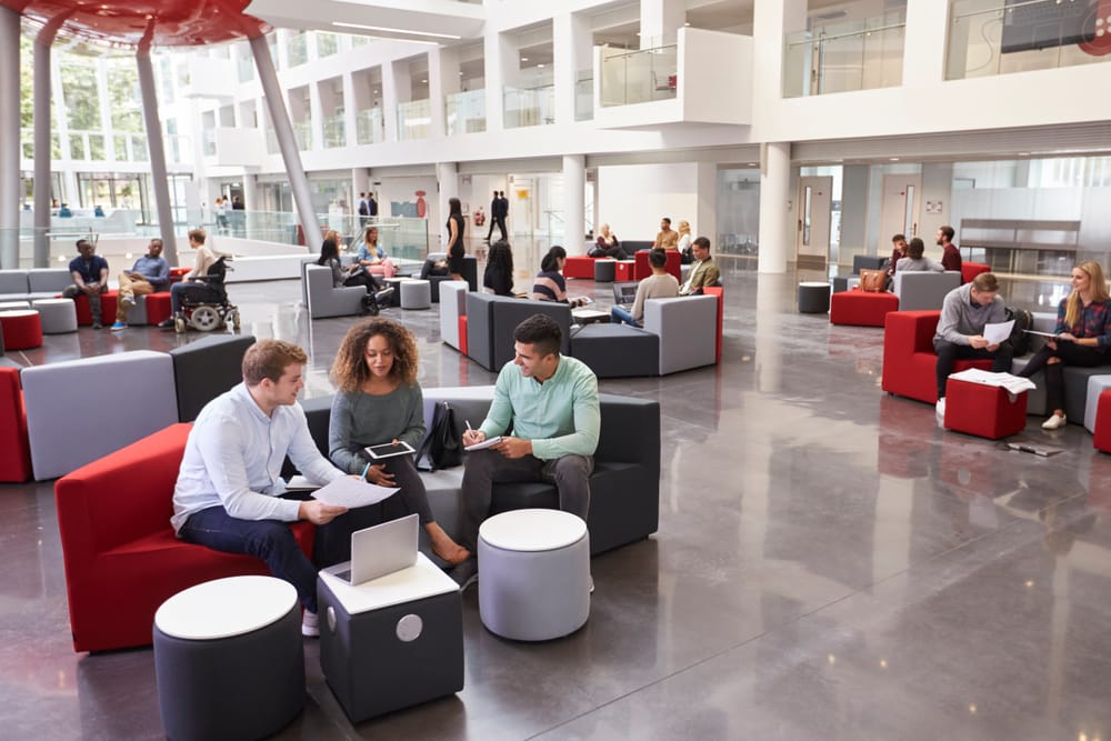 An interior shot of students in a student union in college.