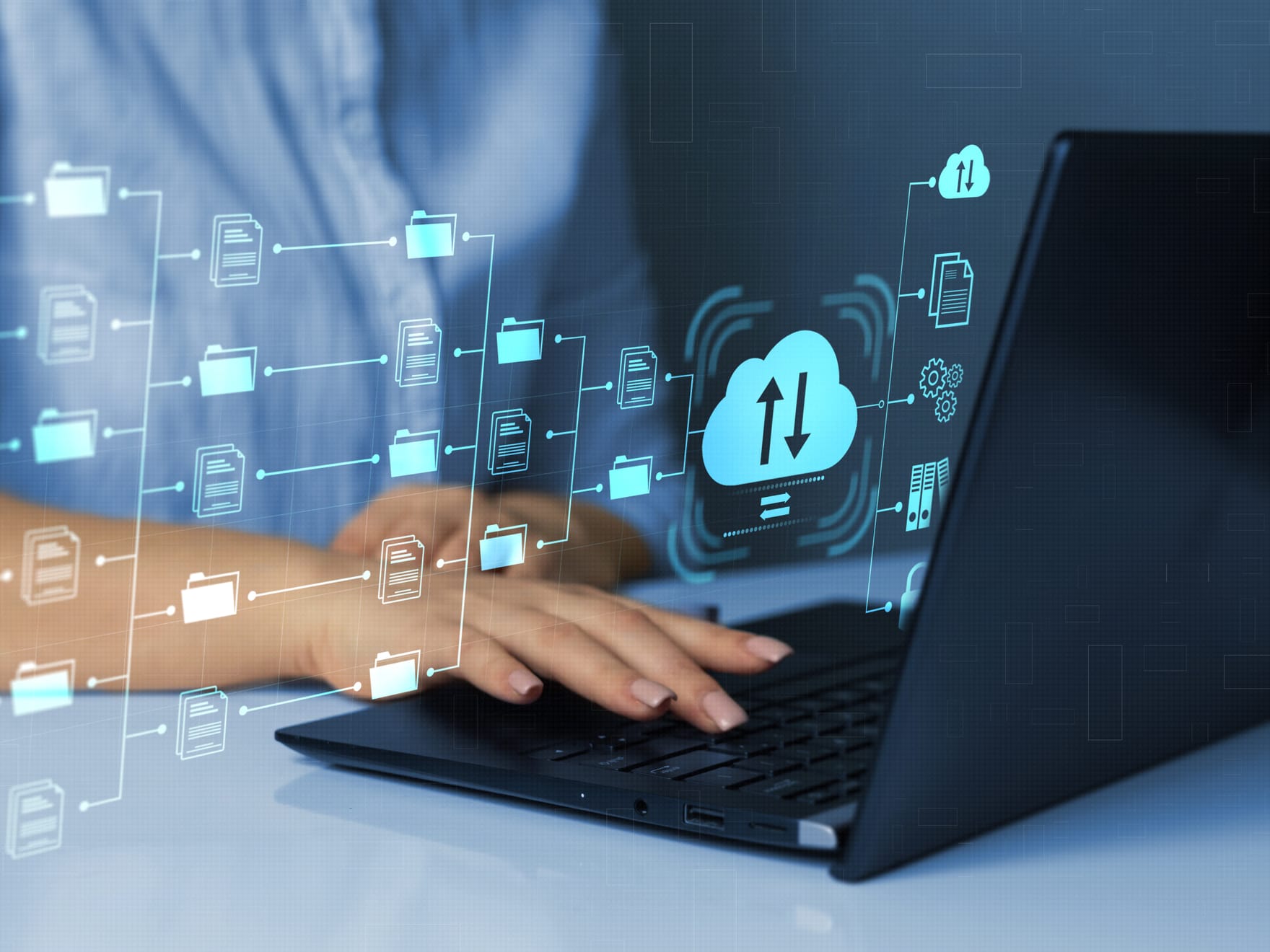 A female is working on a laptop and the image is overlayed with a digital network of files.